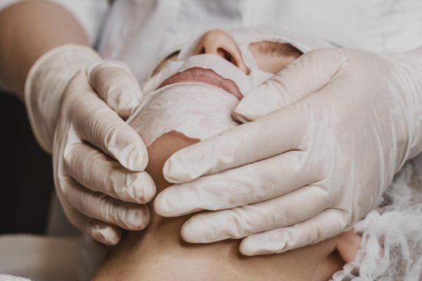 young-beautiful-woman-getting-skin-mask-treatment